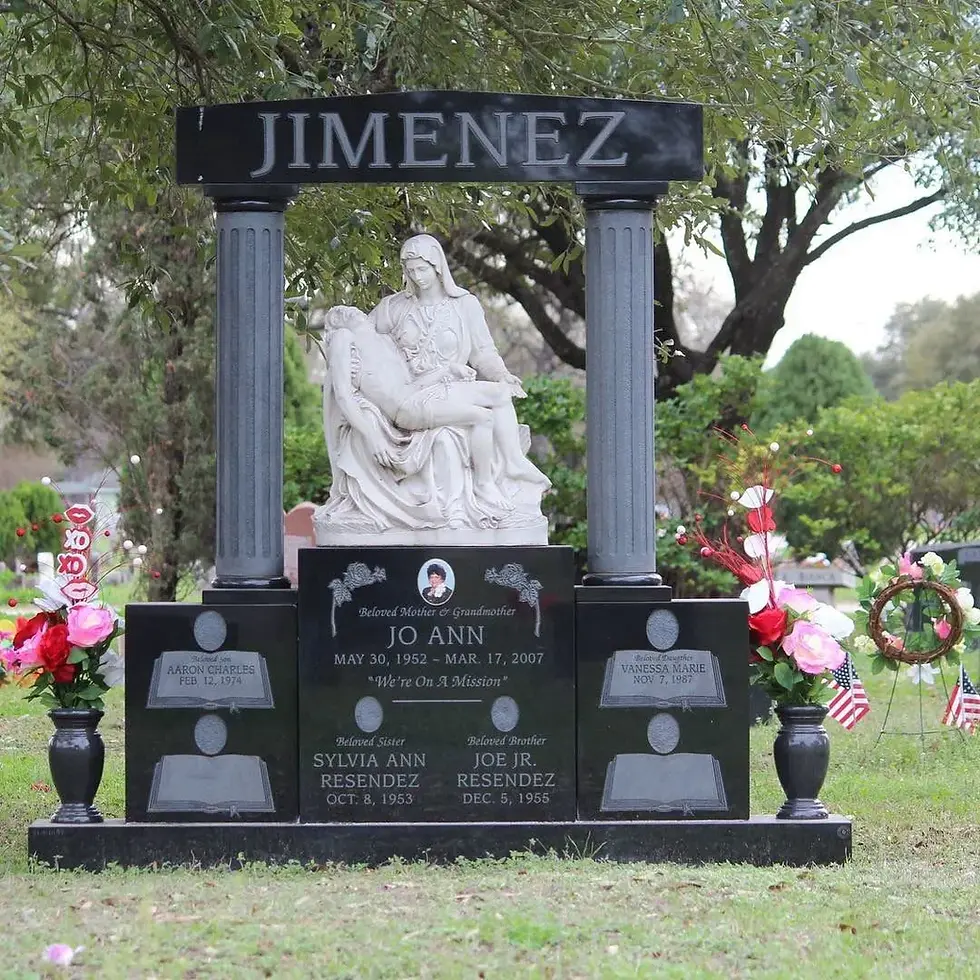Large headstone statue with black granite, white text, and a large grey granite statue of a saint dallas fort worth texas