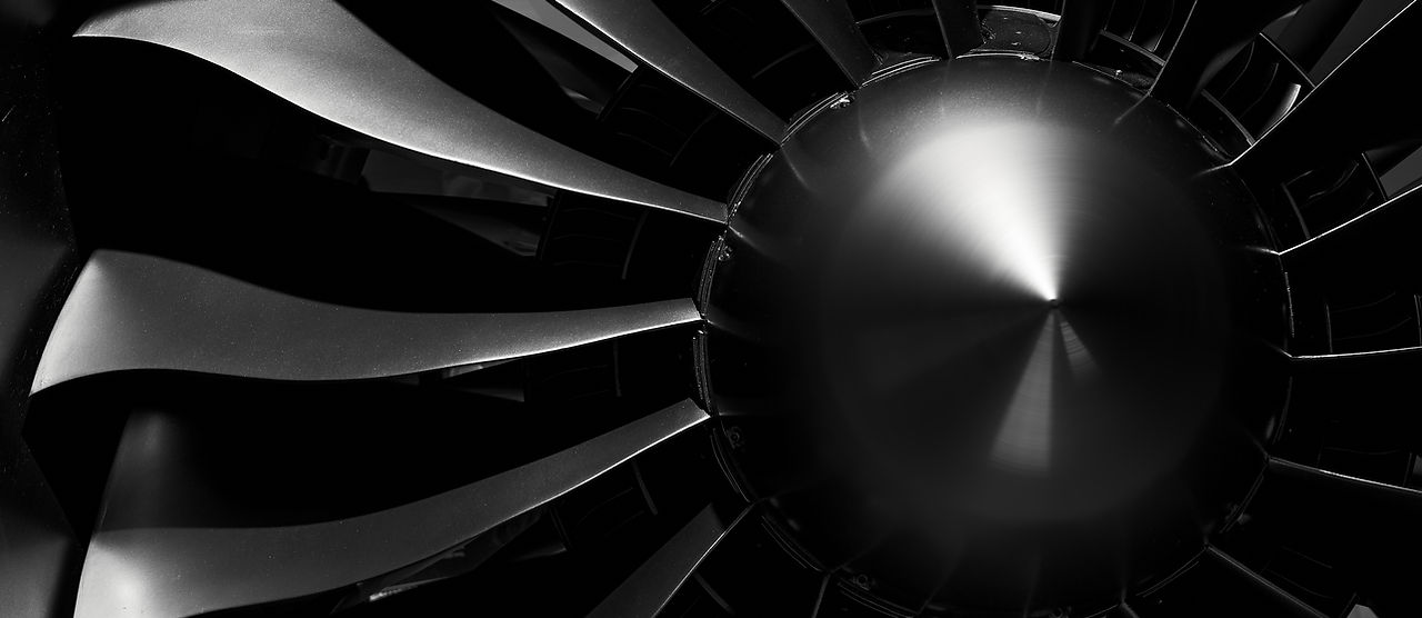 Modern turbofan engine. close up of turbojet of aircraft on black background. blades of th