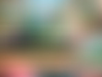 People in vintage attire sit around a table in a garden setting, engaged in conversation. Text reads "Learn Grammar Through Short Stories."