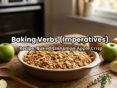 Baking scene with a bowl of apple crisp and apples on a wooden table. Text reads "Baking Verbs (Imperatives): Recipe: Baked Cinnamon Apple Crisp."