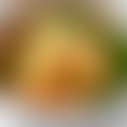 Imperative Verbs for Recipes: White bowl of pasta salad with grated cheese, herbs, and vegetables, set on a white surface. Bright and fresh appearance.