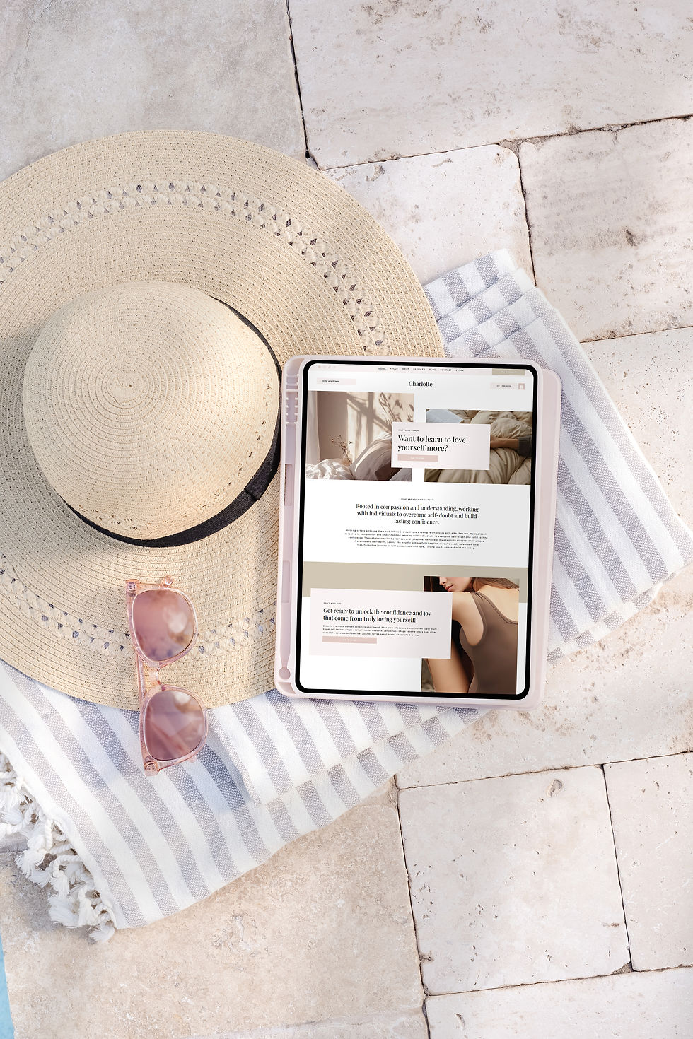 Tablet displaying website on beach towel