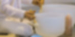 Person playing crystal singing bowls for meditation, spiritual healing The Celestial Garden