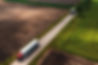 two-large-semi-trucks-on-countryside-road-seen-fro-2024-12-06-20-41-17-utc (1).jpg