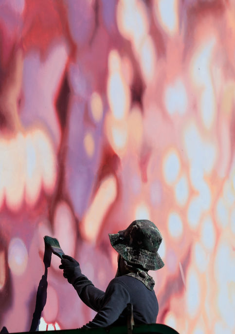 Hand painted advertisement for Spotify featuring Bad Bunny in Williamsburg, Brooklyn