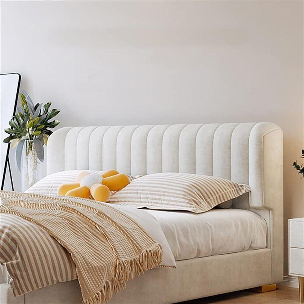 White upholstered bed with vertical channel tufting