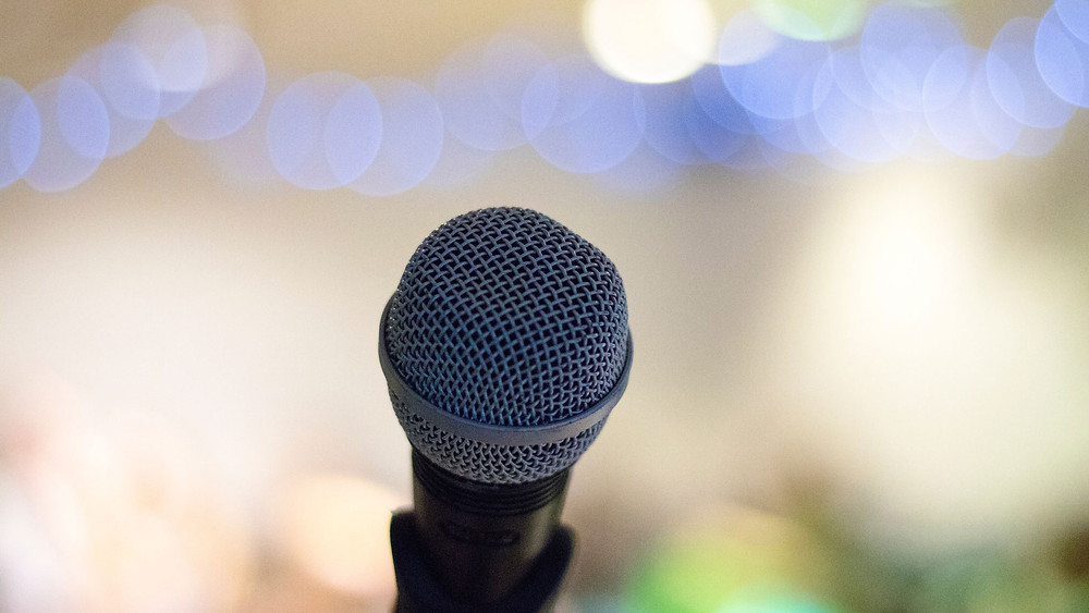 A microphone in front of an audience