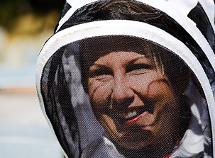woman in bee suit on honey and hive tour in Dunedin