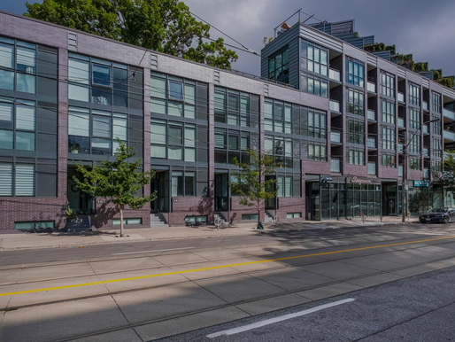 Ontario mortgage rate comparison 2025 – spring buying and refinancing opportunities across A and B lenders Modern apartment building with large windows and balconies, street in foreground. Overcast sky, trees, parked cars, and shops visible.