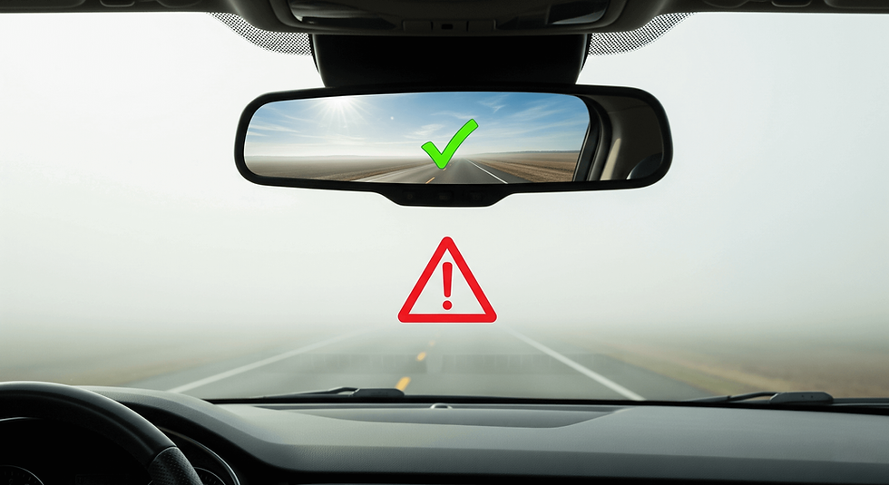 A car's rearview mirror showing a green checkmark, while the foggy windshield shows a red warning sign, symbolizing the danger of a lagging client health score.