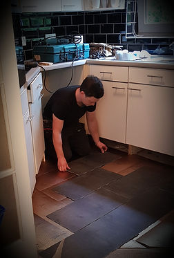 handyman laying tiles