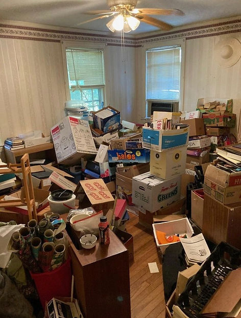House and Property Cleanout in Conroe, TX with boxes stacked up