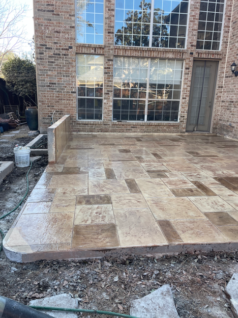 A completed stone-pattern stamped concrete patio.