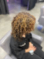 Honey blonde highlights on curls