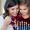 Mother and Daughter Lighting Candles