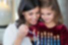 Jewish Family Lighting Shabbat Candles