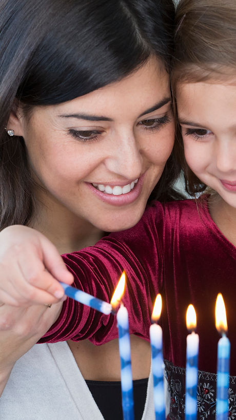 Mother and Daughter Lighting Candles
