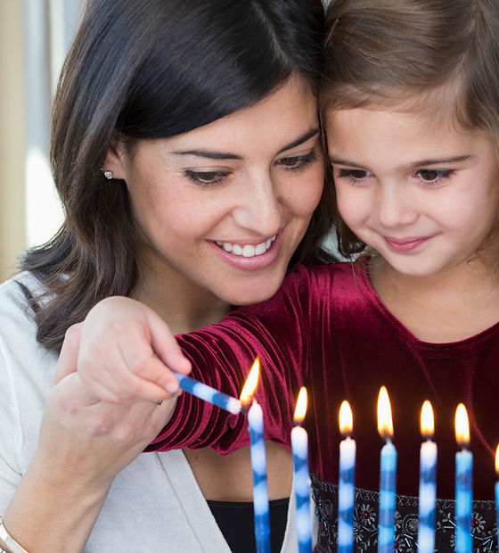 Mother and Daughter Lighting Candles
