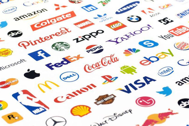 An array of various brand logos on a white background, including Coca-Cola, Nike, Apple, and Google, showcasing diverse colors and styles.