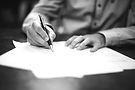 Man signing paperwork