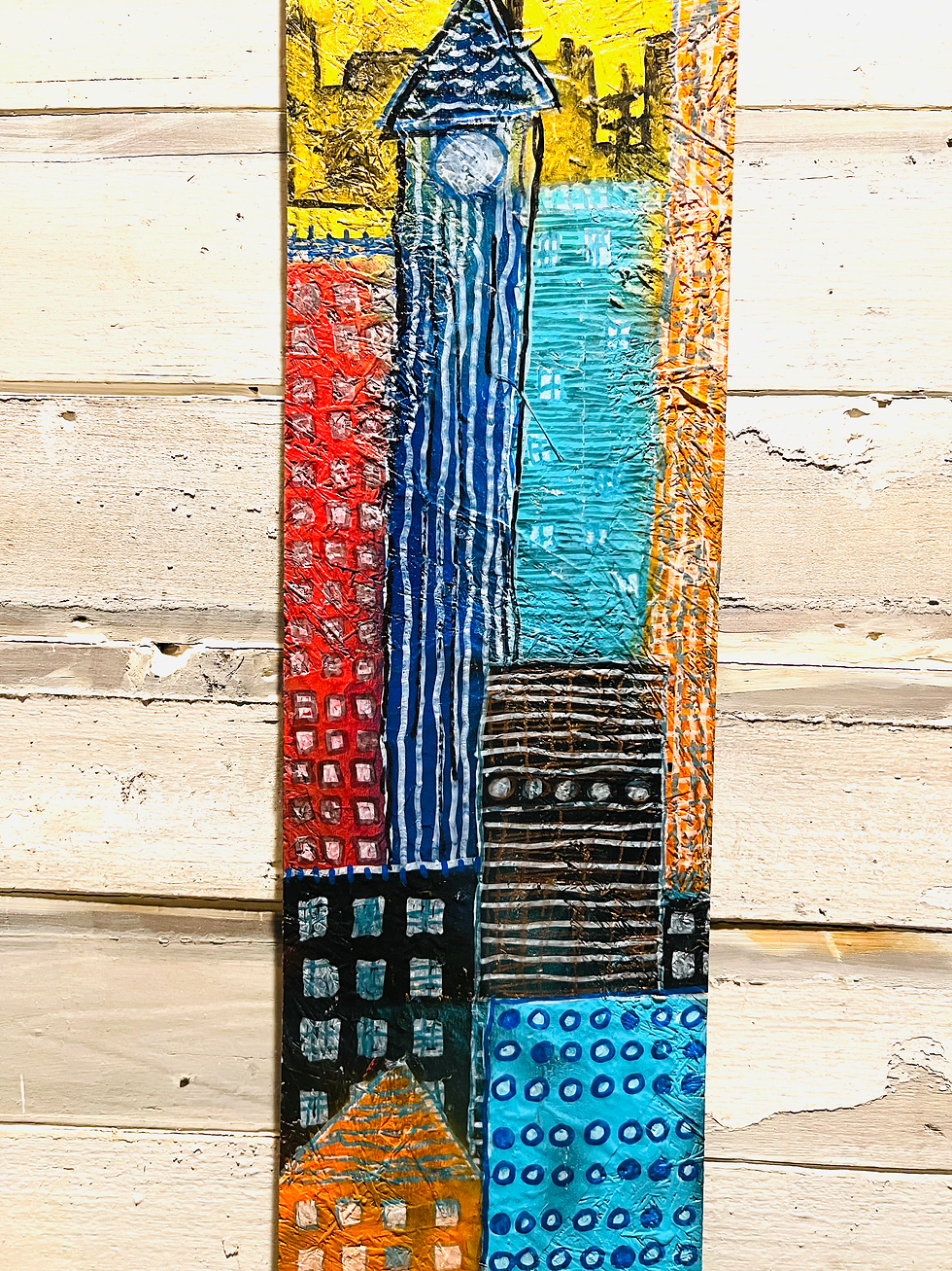 Thumbnail: Tall Town 9” x 40 “ Mixed Media on Wood