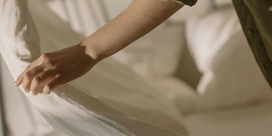 A woman making her bed