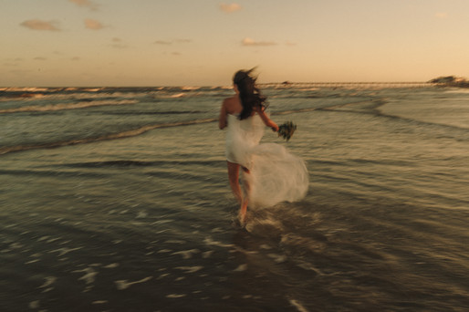 Cinematic sunset beach portrait of Sophie in Galveston, TX captured by Cowboy Creative Co.