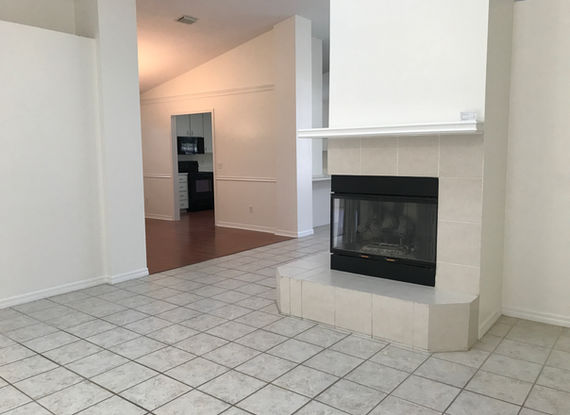 living room with view of dining room and fireplace.JPG