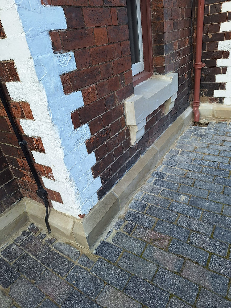 Another view of the renewed plinth course. James Pearson