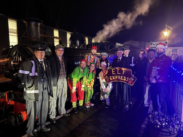 Martin holding the headboard with the team at Bridgnorth for the Elf Express. PAUL TANNER