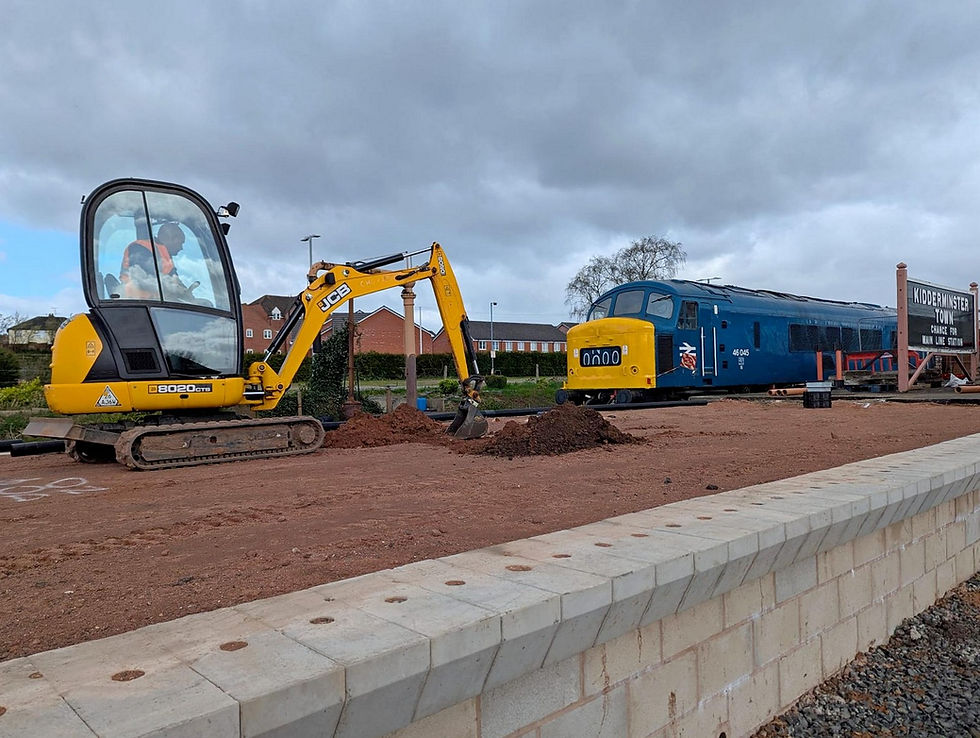 PW staff using JCB to install drainage on the Kidderminster Platform extension. Brent Cleeton
