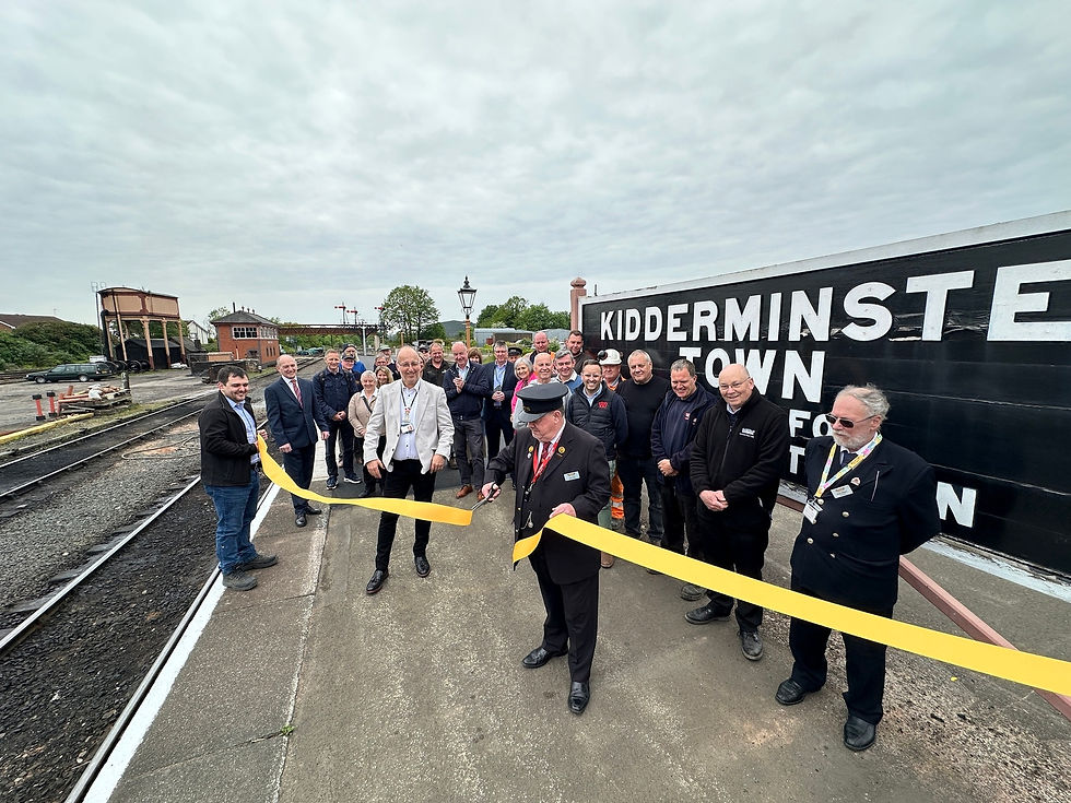 Kidderminster stationmaster Rob Jones cuts the ribbon for the new platform extension