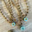 Thumbnail: Dainty Flora Aqua Beach Necklace With Sand Color Crystals