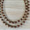 Thumbnail: Crystal Droplet Necklace In Golden Cranberry Shimmer