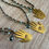 Thumbnail: Hamsa Hand Necklace With Green Quartz Drop