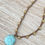 Thumbnail: Carved Stone Amazonite Flower On Crocheted Crystal Strand