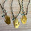 Thumbnail: Hamsa Hand Necklace With Green Quartz Drop