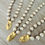 Thumbnail: Classic Glass Pearl Necklace And Handmade Marsh Flower Charm