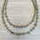Thumbnail: Sea Green And Grey Long Crystal Strand.