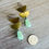 Thumbnail: Double Half Moon Earrings With Mint Crystal Drop