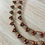 Thumbnail: Crystal Droplet Necklace In Golden Cranberry Shimmer