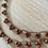 Thumbnail: Crystal Droplet Necklace In Golden Cranberry Shimmer
