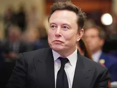 Elon Musk listens as U.S. President-elect Donald Trump addresses a House Republicans Conference meeting at the Hyatt Regency on Capitol Hill on Nov. 13, 2024 in Washington, DC