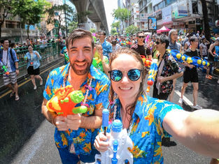 Revelers carry water guns as they celebrate the Songkran holiday