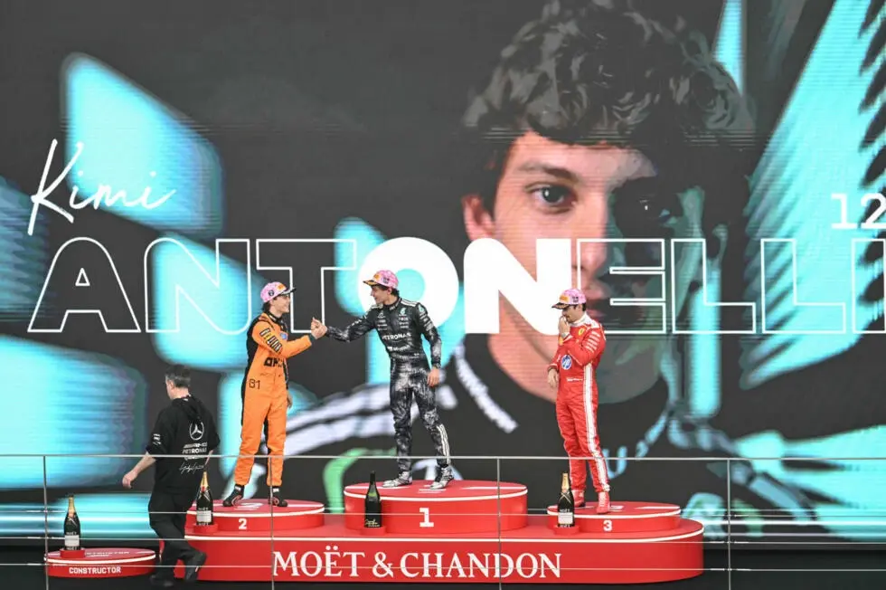 Kimi Antonelli (C), Oscar Piastri (L) and Charles Leclerc (R)on the podium after the Formula One Japanese Grand Prix