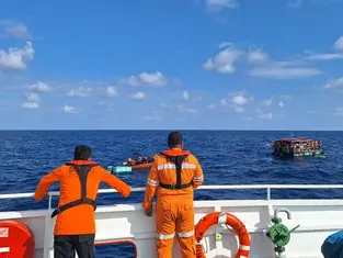 Indonesian search teams rescued 21 people from a raft Tuesday morning