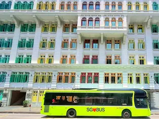 A bus runs past the Old Hill Street Police Station in Singapore
