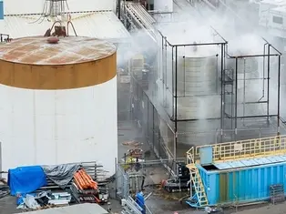 Water is sprayed on a damaged tank at GKN Aerospace in Garden Grove, Calif., on Sunday, May 24, 2026, after the tank containing a chemical used to make plastic parts overheated