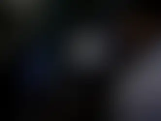 Visitors stand near a sign of artificial intelligence at an AI robot booth at Security China