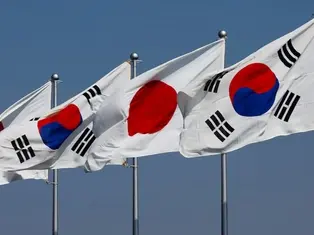 A view of South Korean and Japanese national flags in Tokyo, Japan, March 16, 2023